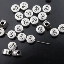 10 Metallperlen "&" Sonderzeichen 7x4 mm...